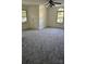 Large bedroom featuring new carpet, natural light and ceiling fan at 8731 Sheltonham Way, Charlotte, NC 28216