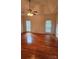 Bedroom features wood floors, modern ceiling fan, and natural light at 8731 Sheltonham Way, Charlotte, NC 28216