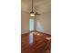Bedroom features wood floors, ceiling fan, and natural light at 8731 Sheltonham Way, Charlotte, NC 28216