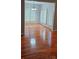 Bright dining room features wood floors, plantation shutters and modern lighting at 8731 Sheltonham Way, Charlotte, NC 28216