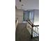 Upstairs hallway with carpet flooring and white doors at 8731 Sheltonham Way, Charlotte, NC 28216