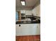 Kitchen with white cabinets, black granite countertops, and stainless steel appliances at 8731 Sheltonham Way, Charlotte, NC 28216