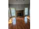 Spacious living room features wood floors, fireplace and lots of natural light at 8731 Sheltonham Way, Charlotte, NC 28216