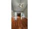 Spacious living room features wood floors, fireplace and lots of natural light at 8731 Sheltonham Way, Charlotte, NC 28216