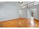 Spacious living room featuring hardwood floors and an open layout with views of the foyer at 8731 Sheltonham Way, Charlotte, NC 28216