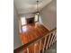 Spacious living room with hardwood floors, fireplace, fan, and lots of natural light at 8731 Sheltonham Way, Charlotte, NC 28216