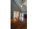 Spacious living room with hardwood floors, fireplace and lots of natural light at 8731 Sheltonham Way, Charlotte, NC 28216