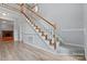 Beautiful staircase with carpet and white wood trim, connecting multiple floors at 8731 Sheltonham Way, Charlotte, NC 28216