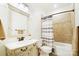 Bathroom with a single sink vanity, neutral paint and combined shower and bathtub at 10000 Blossom Dr, Concord, NC 28025