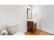 Charming half bath with wood floors, wood vanity, and neutral paint at 10000 Blossom Dr, Concord, NC 28025