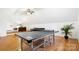 Large bonus room with hardwood floors and a ping pong table at 10000 Blossom Dr, Concord, NC 28025