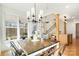 Light-filled dining room featuring a view of the living room and staircase at 10000 Blossom Dr, Concord, NC 28025