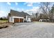 Beautiful home exterior with 2 car garage and chicken coop in the back at 10000 Blossom Dr, Concord, NC 28025