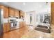 Well-equipped kitchen with stainless steel appliances, wooden cabinets and granite countertops at 10000 Blossom Dr, Concord, NC 28025