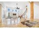 Bright open-concept living space featuring a modern kitchen with granite countertops and stainless steel faucet at 10000 Blossom Dr, Concord, NC 28025