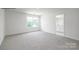 Carpeted bedroom with view of bathroom and closet at 1014 Hostler Ln, York, SC 29745