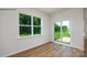 Bedroom with large window and sliding glass doors leading to the backyard at 1014 Hostler Ln, York, SC 29745
