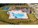 Aerial shot of a community pool with clubhouse, playground, tennis courts and ample parking at 1014 Hostler Ln, York, SC 29745