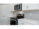 Close-up of a kitchen with stainless steel appliances, subway tile backsplash, and quartz countertops at 1014 Hostler Ln, York, SC 29745