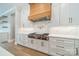 Contemporary kitchen with sleek white cabinetry, a premium range, and designer details, ideal for the discerning home chef at 102 Pecan Cove Ln, Weddington, NC 28104