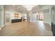 Open-concept living room with a view of the modern kitchen island and stylish lighting, perfect for entertaining and Gathering gatherings at 102 Pecan Cove Ln, Weddington, NC 28104