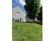 Large backyard featuring a green lawn with fence and tree at 1021 Joselynn Dr, Gastonia, NC 28054