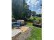 Backyard patio with outdoor seating, garden, and grill at 1021 Joselynn Dr, Gastonia, NC 28054