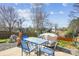Backyard featuring a patio, table with chairs, and clear skies above at 1021 Joselynn Dr, Gastonia, NC 28054