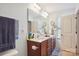 Bathroom with dual sink vanity, and large mirror at 1021 Joselynn Dr, Gastonia, NC 28054
