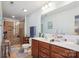 Bathroom with dual sink vanity, glass enclosed tile shower, and tiled floor at 1021 Joselynn Dr, Gastonia, NC 28054