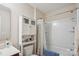 Bathroom with a shower-tub combo, toilet, linen tower, and vanity at 1021 Joselynn Dr, Gastonia, NC 28054
