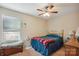 Cozy bedroom featuring a ceiling fan, comfortable bed, and a window with natural light at 1021 Joselynn Dr, Gastonia, NC 28054
