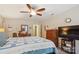 Spacious primary bedroom featuring a ceiling fan, large bed, and dresser at 1021 Joselynn Dr, Gastonia, NC 28054