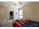 Bedroom with a ceiling fan, patterned blanket, and a window that brings in natural light at 1021 Joselynn Dr, Gastonia, NC 28054