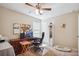 Bedroom featuring a ceiling fan, desk with a computer, and a window offering natural light at 1021 Joselynn Dr, Gastonia, NC 28054