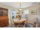Cozy dining area featuring wood table, chairs, and a stylish hutch at 1021 Joselynn Dr, Gastonia, NC 28054