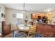 Cozy dining area with wood table, chairs, and stylish blue rug at 1021 Joselynn Dr, Gastonia, NC 28054