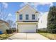 Charming two-story home showcasing a garage and a well-maintained yard at 1021 Joselynn Dr, Gastonia, NC 28054