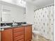 Bathroom featuring a double sink vanity, granite countertop, and shower with patterned curtain at 1065 Ellis Pond Dr, Rock Hill, SC 29730