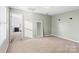 Neutral-toned bedroom with ample natural light, leading into an ensuite bathroom at 1065 Ellis Pond Dr, Rock Hill, SC 29730