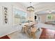 Bright dining room with farmhouse-style table and bench, shiplap walls, and ample natural light at 1065 Ellis Pond Dr, Rock Hill, SC 29730