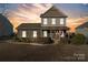 Charming brick and siding home with a covered front porch and well-manicured landscaping at 1065 Ellis Pond Dr, Rock Hill, SC 29730