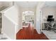 Hallway showcasing hardwood floors and an arched entryway leading to a dining area and living room at 1065 Ellis Pond Dr, Rock Hill, SC 29730