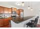 Modern kitchen with granite countertops, stainless steel appliances, and bar seating, perfect for entertaining at 1065 Ellis Pond Dr, Rock Hill, SC 29730
