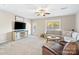 Cozy living room with a ceiling fan, neutral colors, and a comfortable sectional sofa at 1065 Ellis Pond Dr, Rock Hill, SC 29730