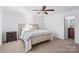 Bright main bedroom with a ceiling fan and access to an ensuite bathroom at 1065 Ellis Pond Dr, Rock Hill, SC 29730