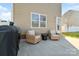 Outdoor patio area with grill and seating, ideal for entertaining guests and relaxing at 1065 Ellis Pond Dr, Rock Hill, SC 29730