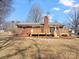 A beautiful brick home with a wooden deck and spacious backyard, perfect for outdoor entertaining and relaxation at 10720 Forest Dr, Matthews, NC 28105