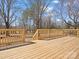New wooden deck overlooking the backyard at 10720 Forest Dr, Matthews, NC 28105