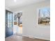 Bright foyer with a modern front door, and a view of the exterior through a large window at 10720 Forest Dr, Matthews, NC 28105